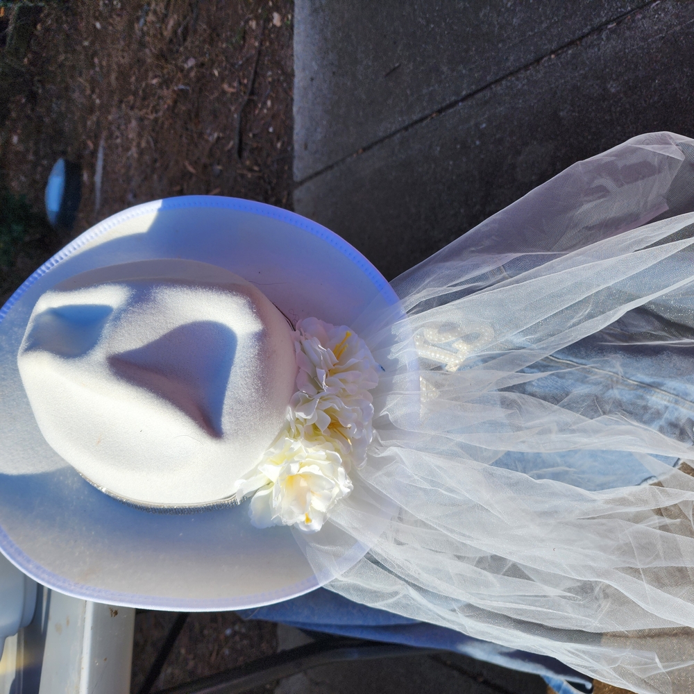 Elegant White Hat with Veil and Floral Accent
